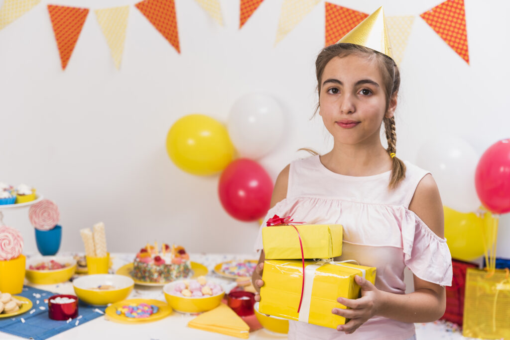 portrait-girl-holding-birthday-presents-her-hand Gifts for 5 year old